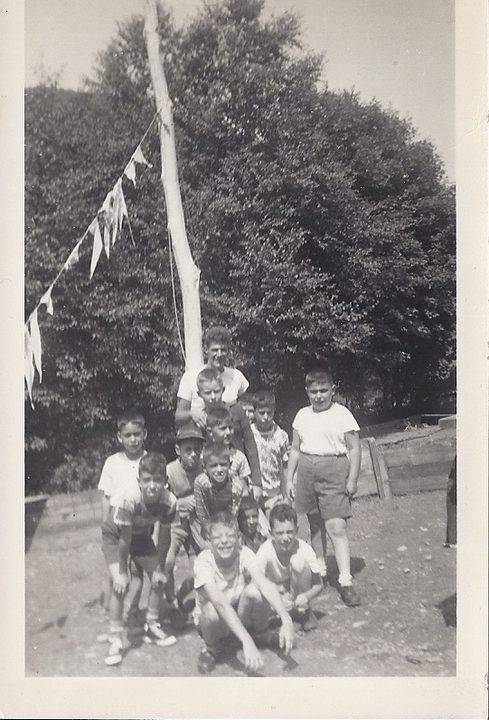 Brother Sam as a camp counselor with his campers around the flagpole, mid-to-late 1940s.